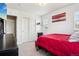 Inviting bedroom featuring a plush bed, ample storage space, and natural light at 2933 Central Park Blvd, Denver, CO 80238