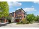 View of multiple homes with a blue sky and an yellow umbrella on the deck at 2933 Central Park Blvd, Denver, CO 80238