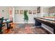 Spacious game room featuring hardwood floors, a shuffleboard table, and charming decor at 2933 Central Park Blvd, Denver, CO 80238