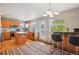 Spacious kitchen featuring stainless steel appliances, wooden cabinets, backsplash, island, and access to dining at 2933 Central Park Blvd, Denver, CO 80238