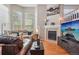 Bright living room featuring a cozy fireplace, large windows, and comfortable seating arrangements at 2933 Central Park Blvd, Denver, CO 80238