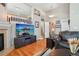 Open-concept living area with hardwood floors, modern decor, and plenty of natural light at 2933 Central Park Blvd, Denver, CO 80238