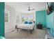 Bright main bedroom with a ceiling fan, many windows, and accent turquoise wall at 2933 Central Park Blvd, Denver, CO 80238