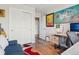 Spacious office features built-in shelving and a TV at 2933 Central Park Blvd, Denver, CO 80238