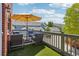 Relaxing patio with comfortable seating, an umbrella for shade, and neighborhood views at 2933 Central Park Blvd, Denver, CO 80238