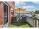 Inviting patio featuring comfortable seating, shade umbrella, and community views at 2933 Central Park Blvd, Denver, CO 80238