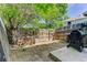 Backyard with a wood fence and trees at 8144 Washington St # 192, Denver, CO 80229