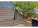 Shaded backyard with a mix of foliage and a wooden fence at 8144 Washington St # 192, Denver, CO 80229