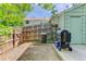 A compact backyard featuring a small patio and wooden fence at 8144 Washington St # 192, Denver, CO 80229
