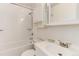 Clean bathroom features white vanity, toilet, and shower-tub combination at 8144 Washington St # 192, Denver, CO 80229