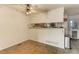 Bright dining area with ceiling fan and views of backyard from Kitchen at 8144 Washington St # 192, Denver, CO 80229