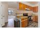 Efficient kitchen design featuring ample counter space, updated appliances, and convenient breakfast bar seating at 8144 Washington St # 192, Denver, CO 80229
