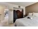 Comfortable bedroom featuring closet and doorway to another room at 8144 Washington St # 192, Denver, CO 80229