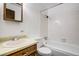 This bathroom features a sink with vanity, toilet, and shower-tub combo at 15157 E Louisiana Dr # A, Aurora, CO 80012