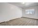 This bedroom features neutral carpet, a window and white walls at 15157 E Louisiana Dr # A, Aurora, CO 80012