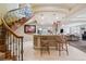 Finished basement features an elegant bar area with seating and a spiral staircase at 5335 E 2Nd Ave, Denver, CO 80220