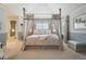 Elegant bedroom with a four-poster bed, soft lighting, and serene decor, creating a peaceful retreat at 5335 E 2Nd Ave, Denver, CO 80220
