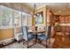 Charming breakfast nook featuring a round table with seating, bathed in natural light from a large window at 5335 E 2Nd Ave, Denver, CO 80220
