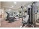 Home gym featuring state-of-the-art exercise equipment, mirrors, and ample workout space at 5335 E 2Nd Ave, Denver, CO 80220