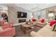 Cozy living room featuring comfortable seating, a modern fireplace, and stylish decor at 5335 E 2Nd Ave, Denver, CO 80220