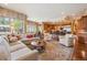 Open-concept living room with a cozy seating area that flows seamlessly into the kitchen with a breakfast bar at 5335 E 2Nd Ave, Denver, CO 80220