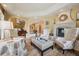 Spacious living room featuring a fireplace, custom seating, and warm neutral paint at 5335 E 2Nd Ave, Denver, CO 80220