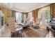 Sitting room with windows, shutters, fireplace and neutral decor at 5335 E 2Nd Ave, Denver, CO 80220
