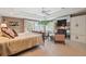 Inviting main bedroom suite featuring a sitting area with a fireplace and access to an outdoor balcony at 5335 E 2Nd Ave, Denver, CO 80220