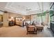 Spacious main bedroom with tray ceiling, sitting area, and large windows, offering comfort and style at 5335 E 2Nd Ave, Denver, CO 80220
