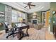 Home office with a fireplace, neutral walls and seating and an antique desk at 5335 E 2Nd Ave, Denver, CO 80220