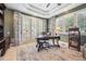 Office space with natural light, French doors, ceiling fan and built-in storage at 5335 E 2Nd Ave, Denver, CO 80220