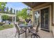 Inviting outdoor patio with dining table, chairs, grill, and elegant lighting for entertaining at 5335 E 2Nd Ave, Denver, CO 80220