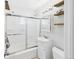 Clean bathroom featuring a shower-tub combo, modern sink, and stylish shelving at 940 Hooker St, Denver, CO 80204