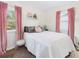 Serene bedroom with plush bedding, light walls, and bright natural light at 940 Hooker St, Denver, CO 80204