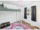 Bright bedroom features a white bunk bed and a colorful area rug at 940 Hooker St, Denver, CO 80204
