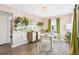 Bright dining room with wood floors, pink walls, and stylish decor at 940 Hooker St, Denver, CO 80204