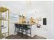 Bright kitchen with bar seating, light countertops, and ample natural light at 940 Hooker St, Denver, CO 80204