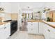 Open-concept kitchen featuring white cabinetry, butcher block countertops and stylish fixtures at 940 Hooker St, Denver, CO 80204