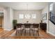 Dining room features contemporary lighting and a stylish buffet, perfect for entertaining at 21284 E 63Rd Dr, Aurora, CO 80019