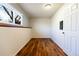 Simple bedroom with white walls, wood floors, and a bright window at 2161 Bowen St, Longmont, CO 80501