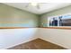 Simple bedroom with green walls, carpeted floors, and a bright window at 2161 Bowen St, Longmont, CO 80501