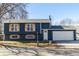 Charming two-story home with blue siding, natural wood shutters, and a well-maintained front yard at 2161 Bowen St, Longmont, CO 80501