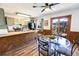 Bright kitchen area featuring a breakfast bar, stainless steel appliances, and an adjacent dining space at 2161 Bowen St, Longmont, CO 80501