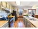 Efficient kitchen space with stainless steel appliances, subway tile backsplash, and wooden accents at 2161 Bowen St, Longmont, CO 80501