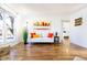 Inviting living room featuring hardwood flooring, a large window, and neutral decor at 2161 Bowen St, Longmont, CO 80501