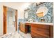 Elegant bathroom with double vanity, stylish mirrors, and contemporary finishes at 4534 Palmer Ct, Longmont, CO 80503