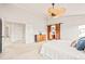 Spacious bedroom with ensuite access and decorative barn-style door at 4534 Palmer Ct, Longmont, CO 80503