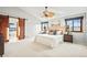 Bright bedroom with barn-style door leading to bath and ample natural light at 4534 Palmer Ct, Longmont, CO 80503