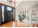 Elegant foyer with hardwood floors, high ceilings, a decorative staircase, and ample natural light at 4534 Palmer Ct, Longmont, CO 80503