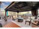 Relaxing outdoor space with gazebo and fire pit on a spacious wooden deck at 4534 Palmer Ct, Longmont, CO 80503
